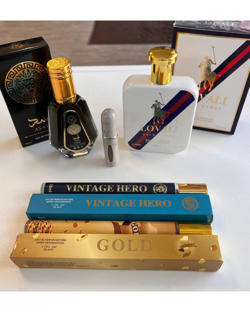 Promo 4 perfumes de caballero + frasco recargable de REGALO